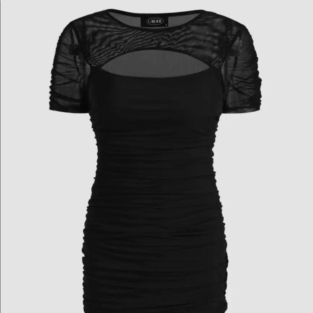 Black mini dress with mesh detailing on the top.